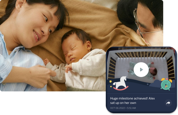 Mom and dad with baby with a display of Nanit app with video of baby sleeping