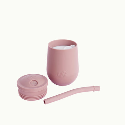 lid and straw removed from mini cup and cup filled with milk in blush 