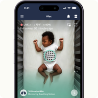 baby sleeping in crib with breathing band on live screen on nanit app with showing stats and monitoring breathing motion