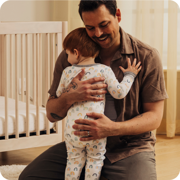 dad hugging toddler